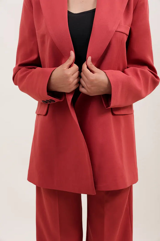 ensemble oversize en polyester orange se compose d'une veste à double boutonnage et d'un pantalon droit à taille haute.