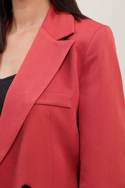 ensemble oversize en polyester orange se compose d'une veste à double boutonnage et d'un pantalon droit à taille haute.