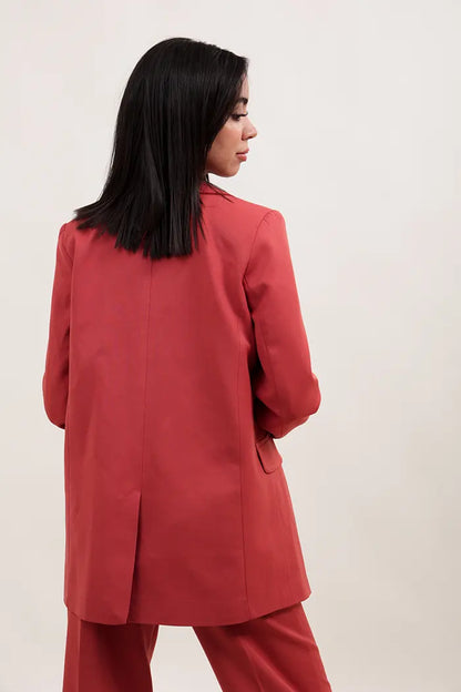 ensemble oversize en polyester orange se compose d'une veste à double boutonnage et d'un pantalon droit à taille haute.